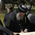 His Grace Bishop Anba Suriel signs the accord